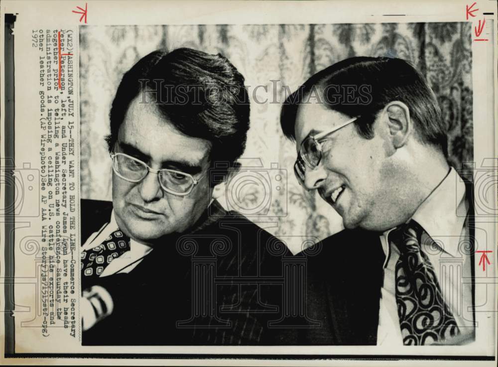 1972 Press Photo Peter Peterson and James Lyon confer prior to D.C. news brief.- Historic Images