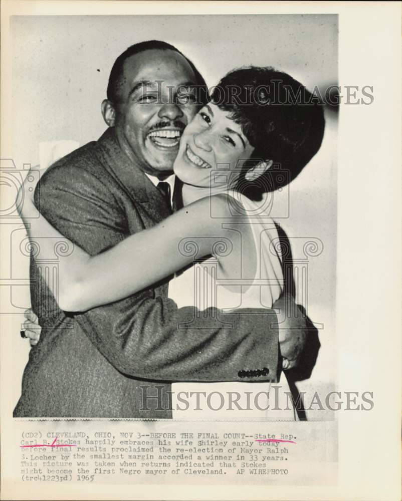 1965 Press Photo Carl B. Stokes embraces wife Shirley after Cleveland election.- Historic Images