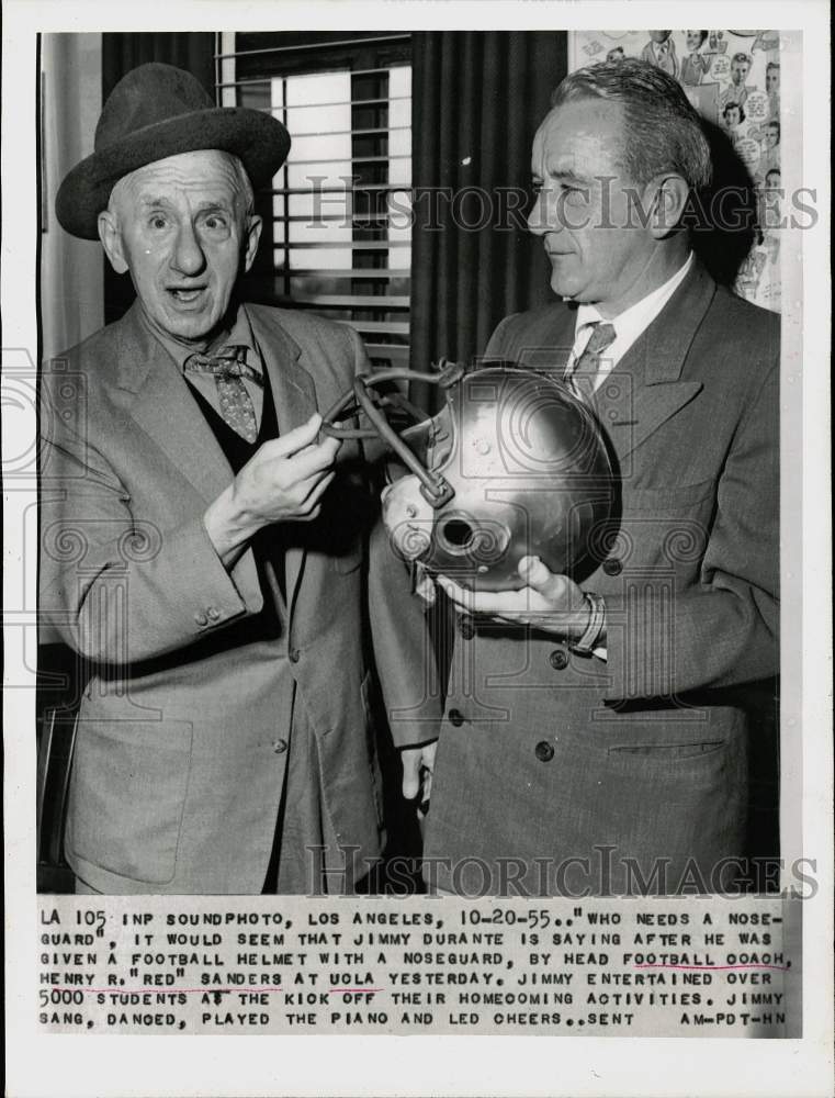 1955 Press Photo Jimmy Durante given helmet by coach before Los Angeles game- Historic Images