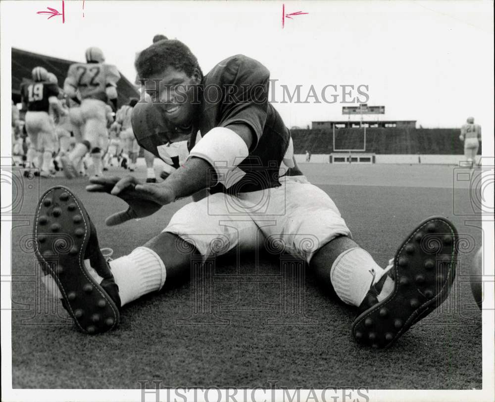 1974 Press Photo Rice player Cornelius Walker limbers up at football practice- Historic Images