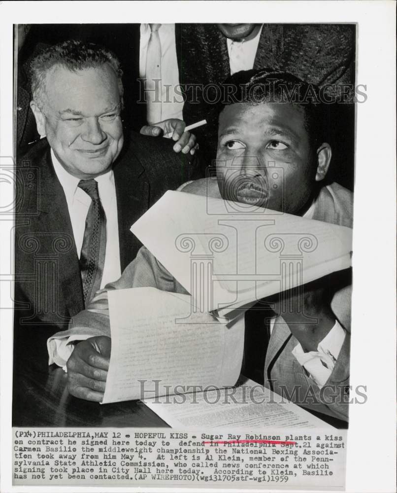 1959 Press Photo Boxer Sugar Ray Robinson signs bout contract in Philadelphia- Historic Images