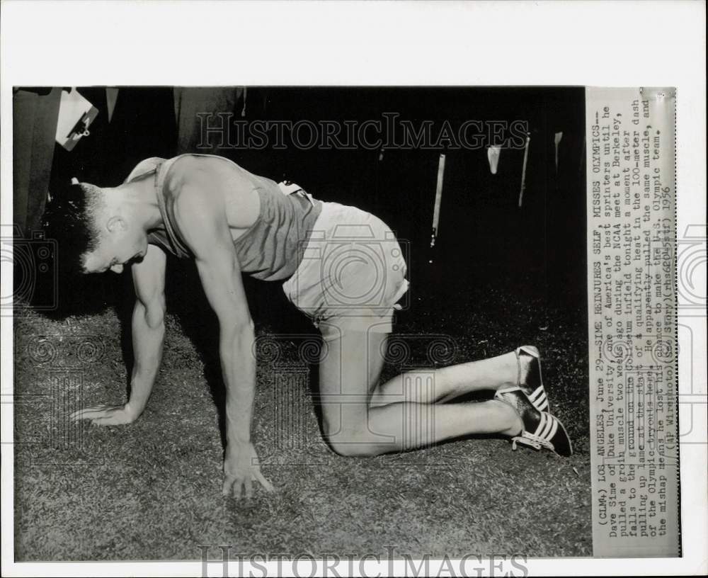 1956 Press Photo Track &amp; field sprinter Dave Sime falls during NCAA meet in CA- Historic Images