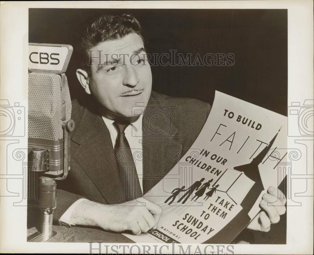 1954 Press Photo Jack Sterling holds a Sunday school poster for children- Historic Images