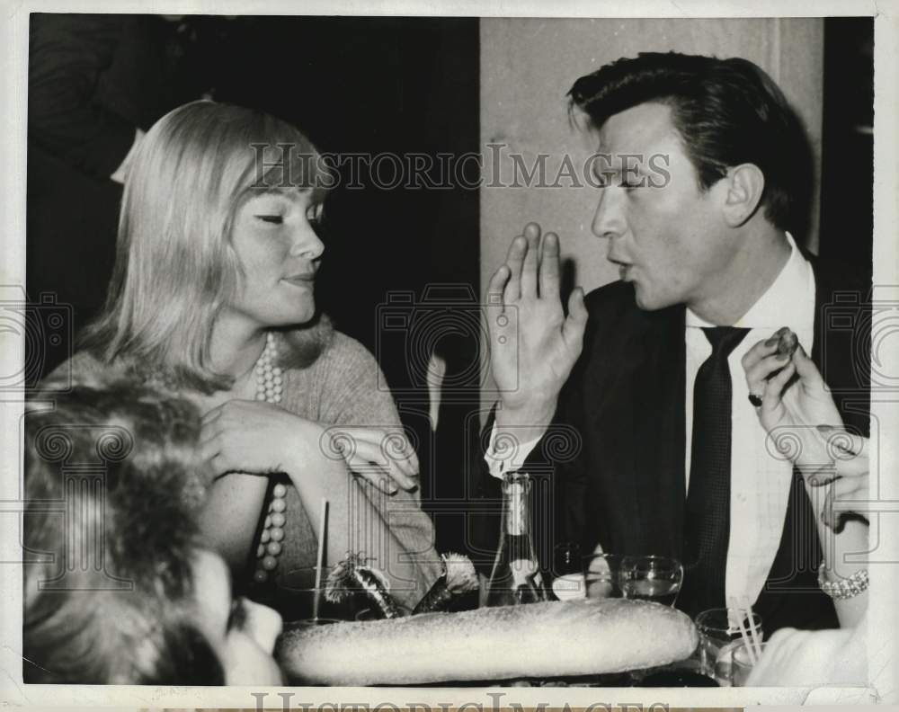 1960 Press Photo Actress May Britt with actor Laurence Harvey in New York.- Historic Images