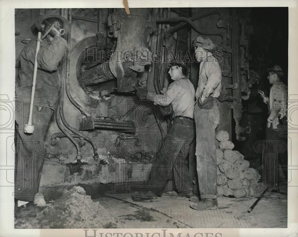 Press Photo Workers repair machinery in the engine room. - kfx28383- Historic Images