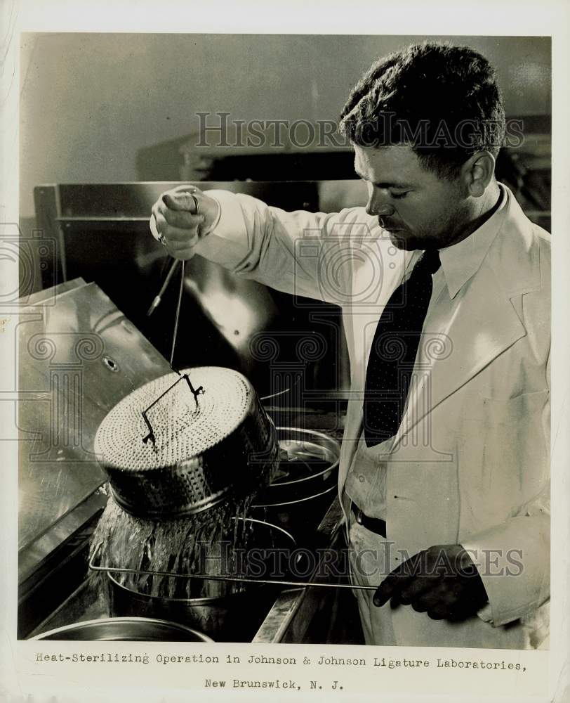 Press Photo Heat-Sterilizing Operation in Johnson &amp; Johnson Ligature Laboratory- Historic Images