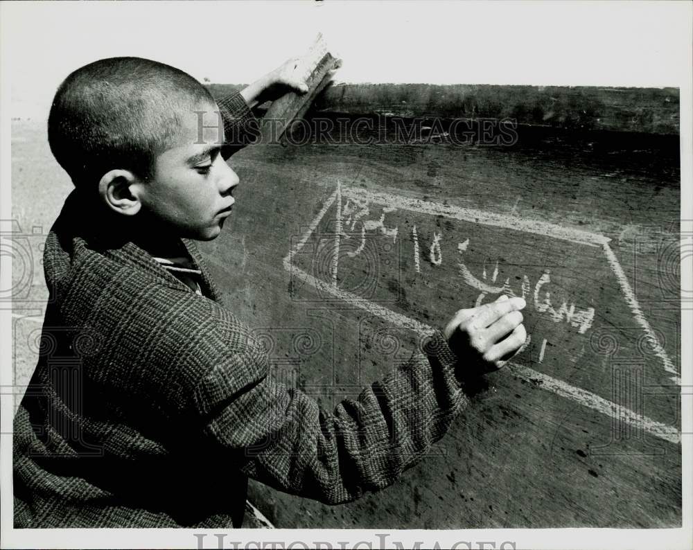 1967 Press Photo Iranian nomad youth outside his tent school. - kfx34889- Historic Images