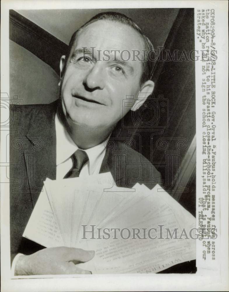 1958 Press Photo Governor Orval Faubus holds messages in Little Rock, Arkansas- Historic Images