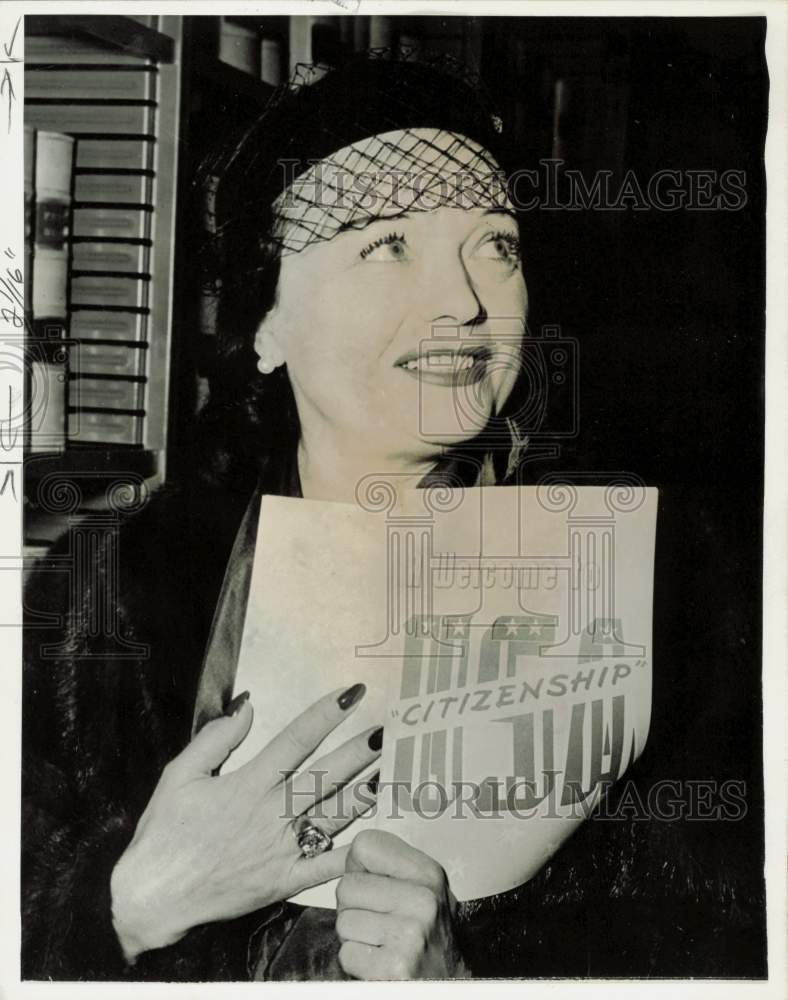 1951 Press Photo Pola Negri holding up her citizenship papers - kfx49543- Historic Images