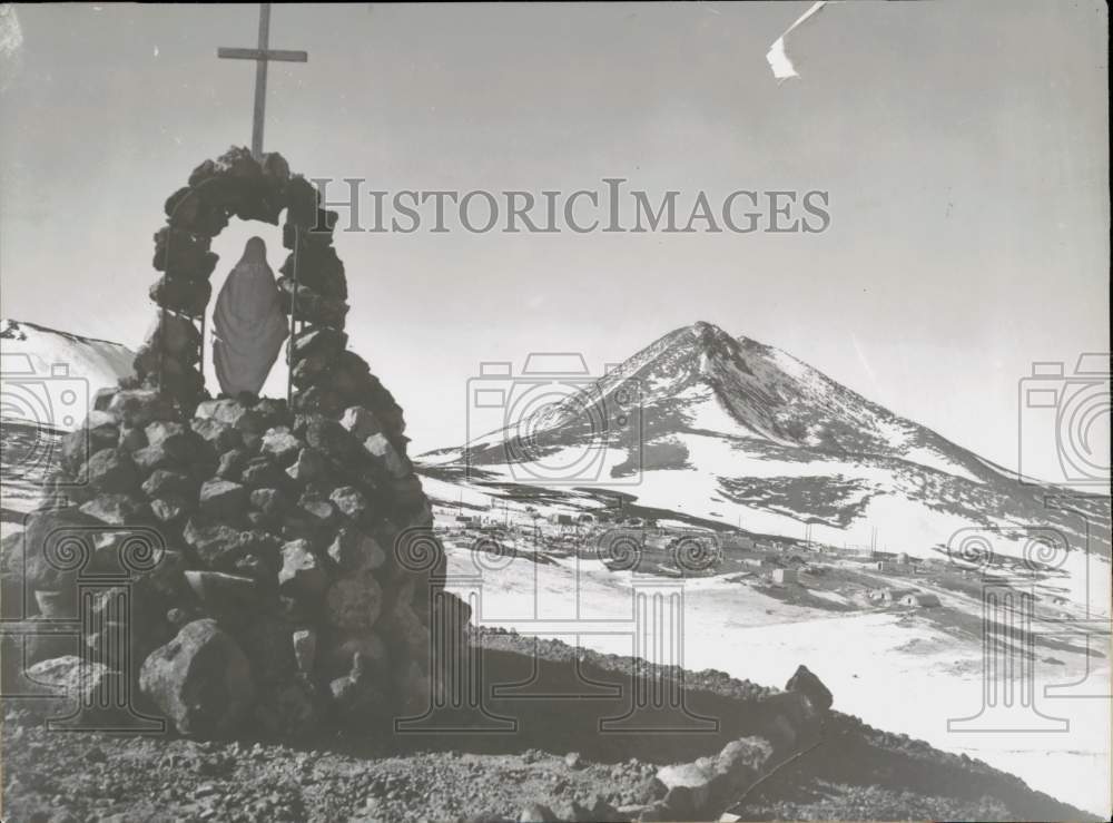 Press Photo Statue of Virgin Mary near a snow covered mountain - lra05010- Historic Images