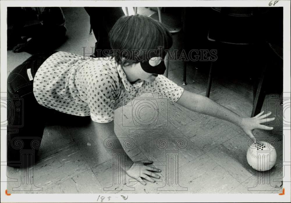 Press Photo Child playing a game with blindfold, ball - lra16645- Historic Images