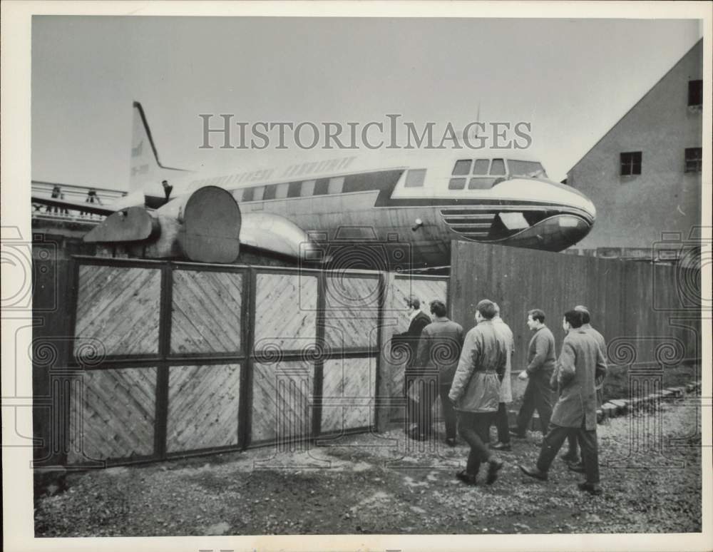 1964 Press Photo A group of men inspects an airplane in Czechoslovakia- Historic Images