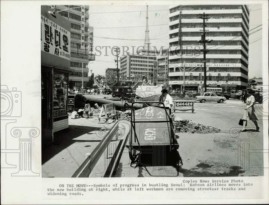 1967 Press Photo Workmen remove streetcar tracks and widen roads in South Korea- Historic Images