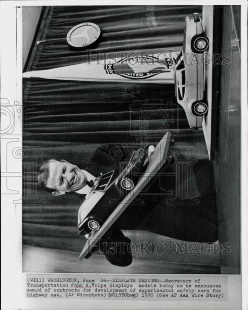 1970 Press Photo Transportation Secretary John Volpe displays car designs- Historic Images