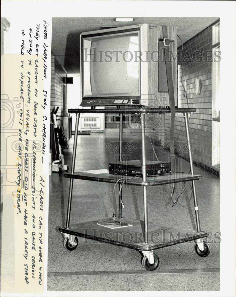 Press Photo Television on AV cart with safety strap - lra36280- Historic Images