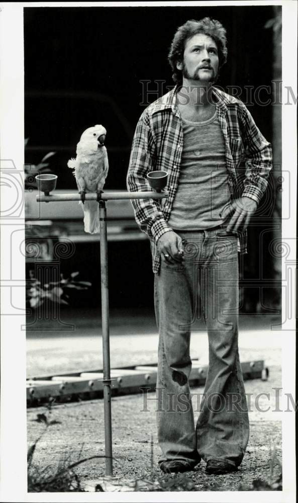 Press Photo A man standing beside his pet bird - lra39907- Historic Images