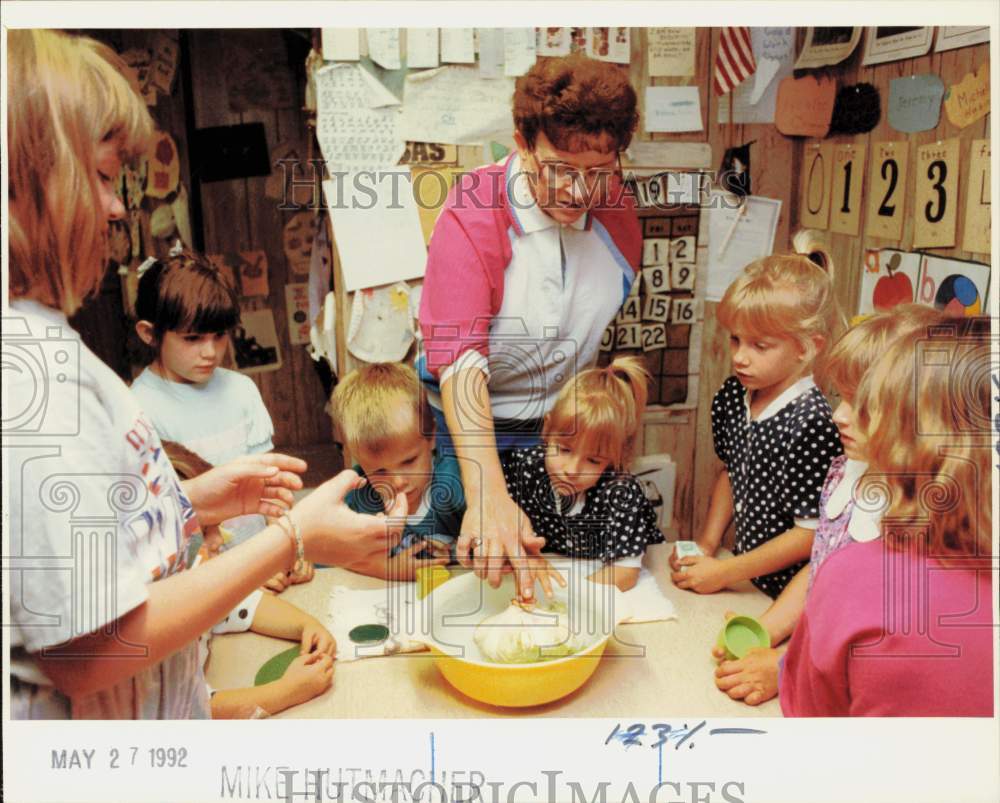 1992 Press Photo Trudie Sturdy demonstrates floating at her day care - lra63417- Historic Images