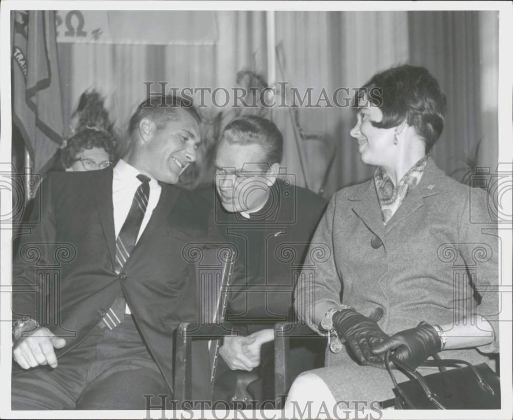 1966 Press Photo Astronaut Richard Gordon and wife talk to friend at an event- Historic Images