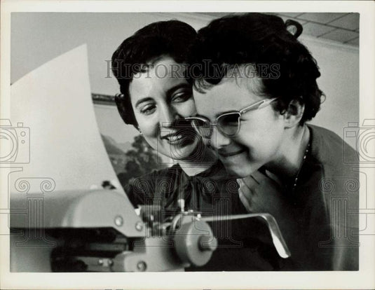 1963 Press Photo Renee and her mother type textbook in oversize print- Historic Images