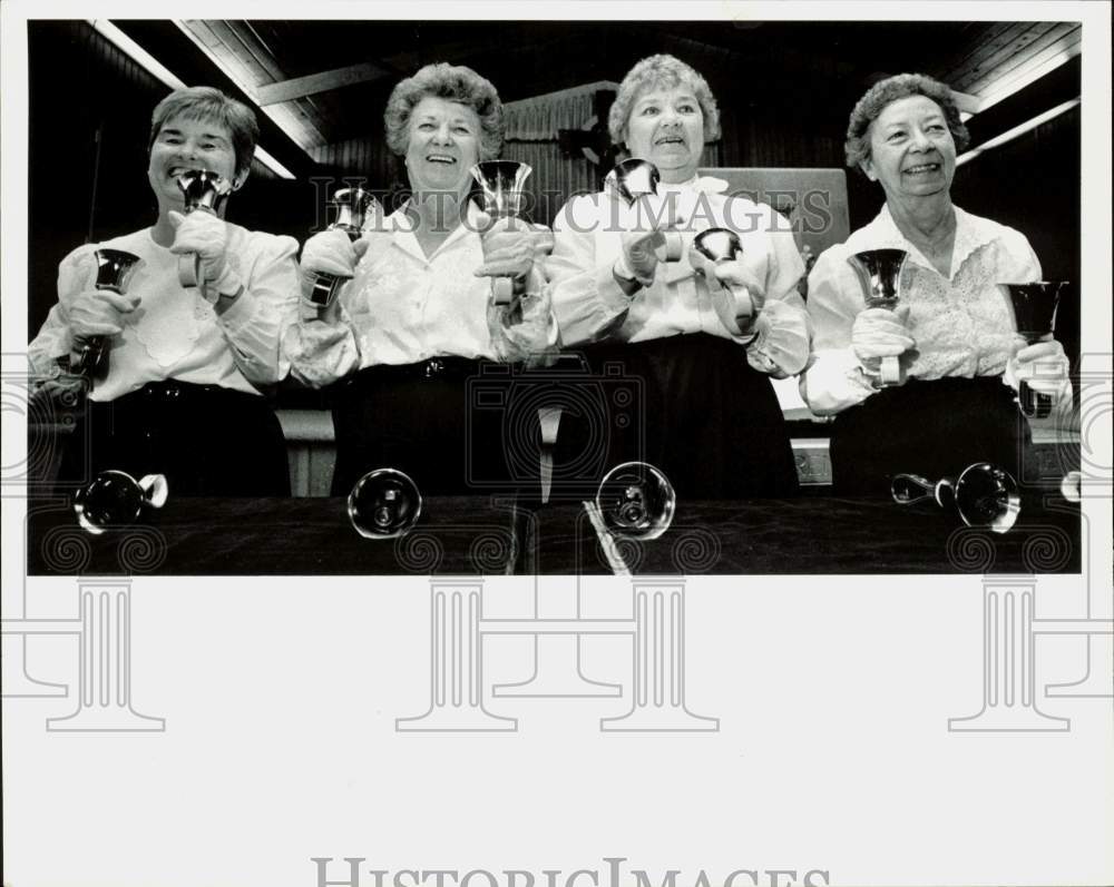 1989 Press Photo Marge van Goethem and group ring bells during performance- Historic Images