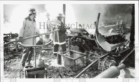 1989 Press Photo Firemen Jeff Simmons & Jim Frary hose down fire in Otisco barn- Historic Images