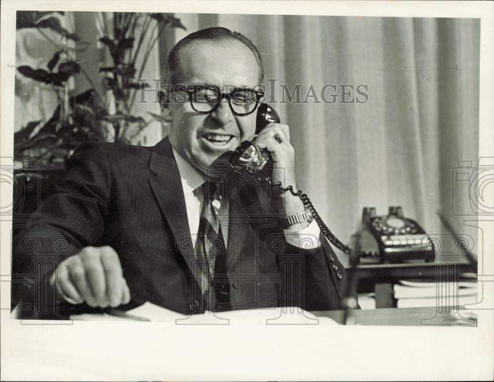 1967 Press Photo Doctor Dion Colvard speaks on the phone in office - lrb01668- Historic Images