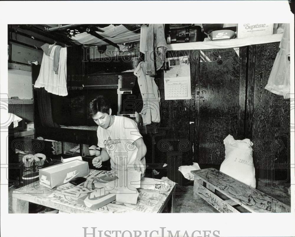 1990 Press Photo Jose Pham writes a letter aboard the vessel Royal Aleutian- Historic Images