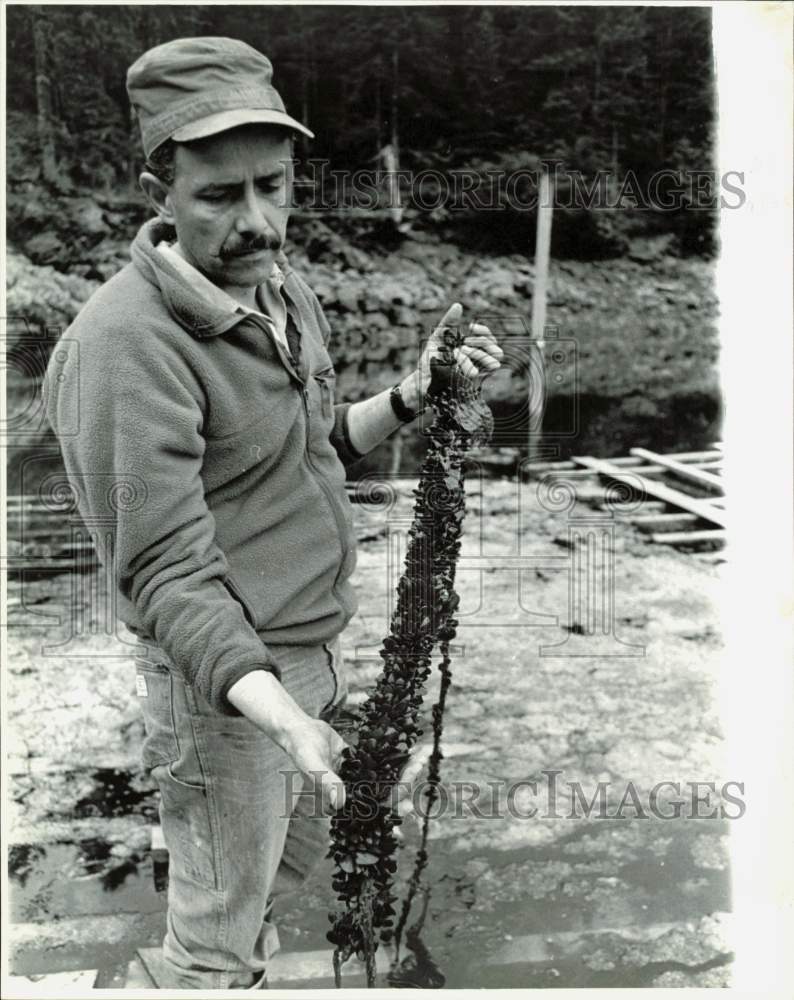 1990 Press Photo Richard Perea Holding Plant - lrb16446- Historic Images