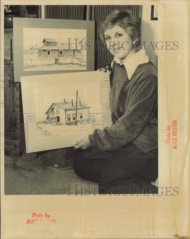 1984 Press Photo Artist Jan Kuschner shows one of her paintings in Anchorage, AK- Historic Images