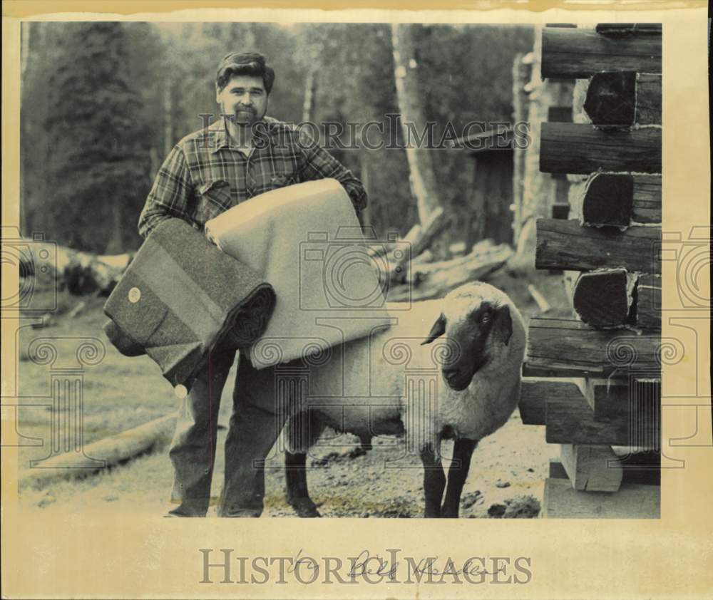 1988 Press Photo Man stands beside ram with blankets made from his wool- Historic Images