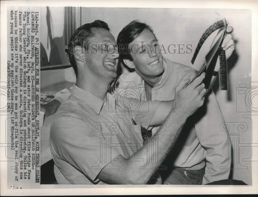 1963 Press Photo Sam Goldwyn &amp; Peter Fonda Check Film Strips of The Young Lovers- Historic Images