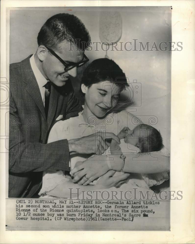 1961 Press Photo Germain Allard tickles son while mother looks on in Montreal- Historic Images