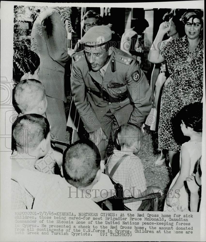 1965 Press Photo Brig. Bruce McDonald meets children at Red Cross home, Cyprus- Historic Images