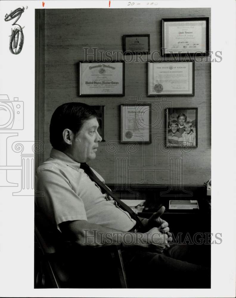 Press Photo Chuck Thompson in Office with Certificates - lry25484- Historic Images