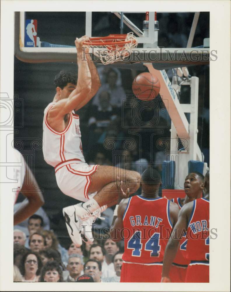 1990 Press Photo Rony Seikaly, of the Miami Heat hangs off rim after dunk.- Historic Images