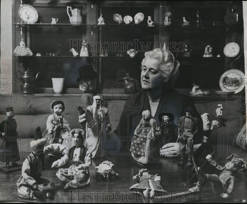 Load image into Gallery viewer, 1956 Press Photo Mrs Aaron w/ her collection of dolls dressed in National Dress
