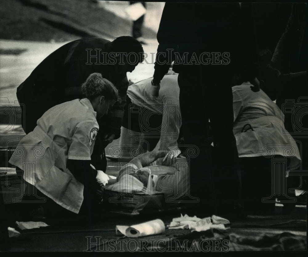 1991 Press Photo City Worker Michael Sliga Struck by Car From Milwaukee Manhole- Historic Images