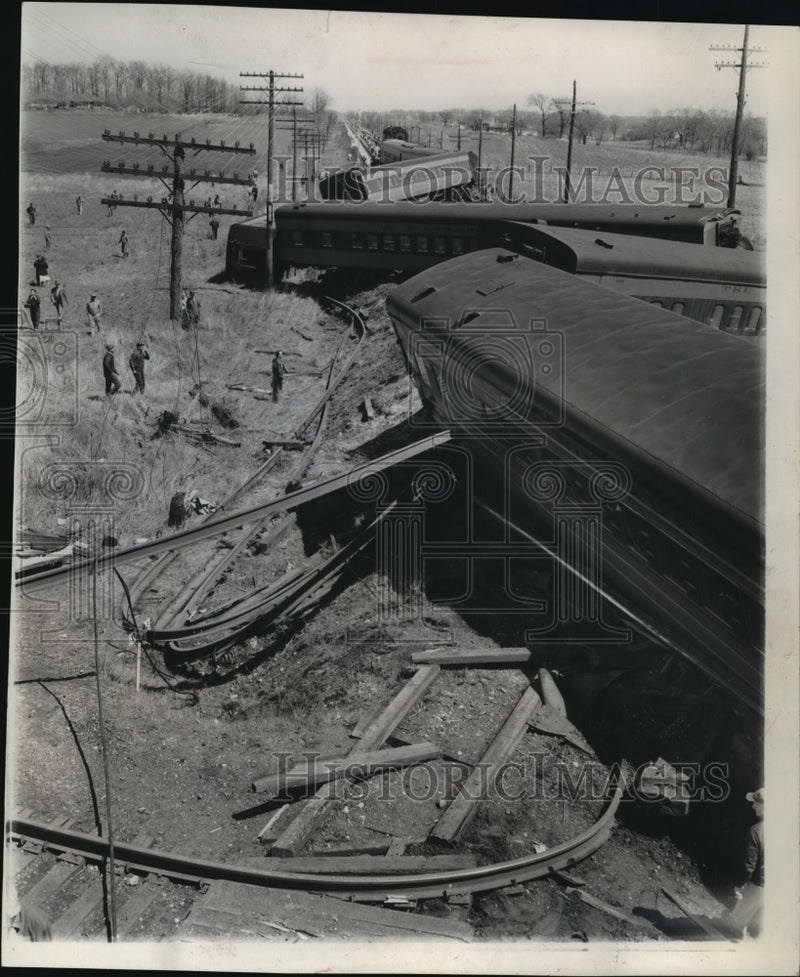 Load image into Gallery viewer, 1956 Press Photo Twisted rails and a tangle of coaches littered the tracks

