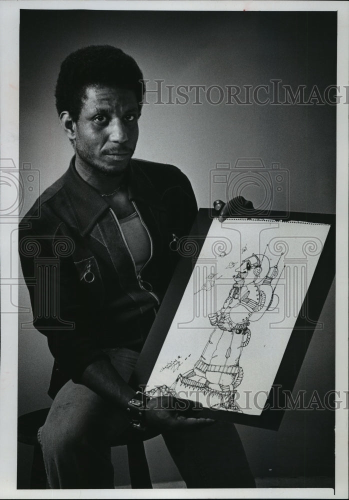 Load image into Gallery viewer, 1978 Press Photo Charles Ballard Jr and one of his cartoons - mja02438
