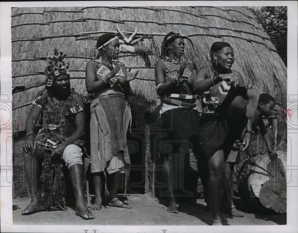 1963 Press Photo Watching three of his six remaining wives dance, the Zulu chief