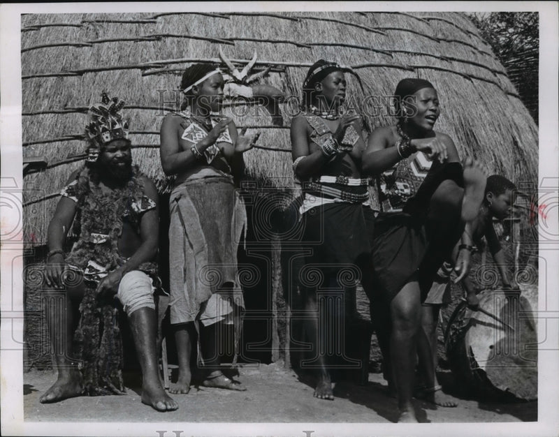 Load image into Gallery viewer, 1963 Press Photo Watching three of his six remaining wives dance, the Zulu chief
