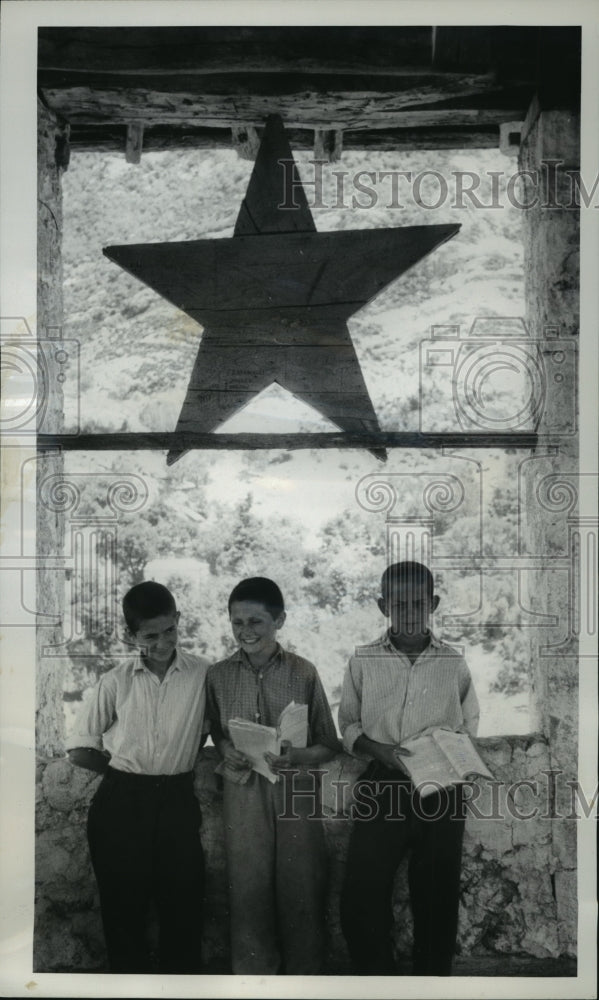 Load image into Gallery viewer, 1962 Press Photo Huge wooden Red Star hangs over tower in Tirana, Albania
