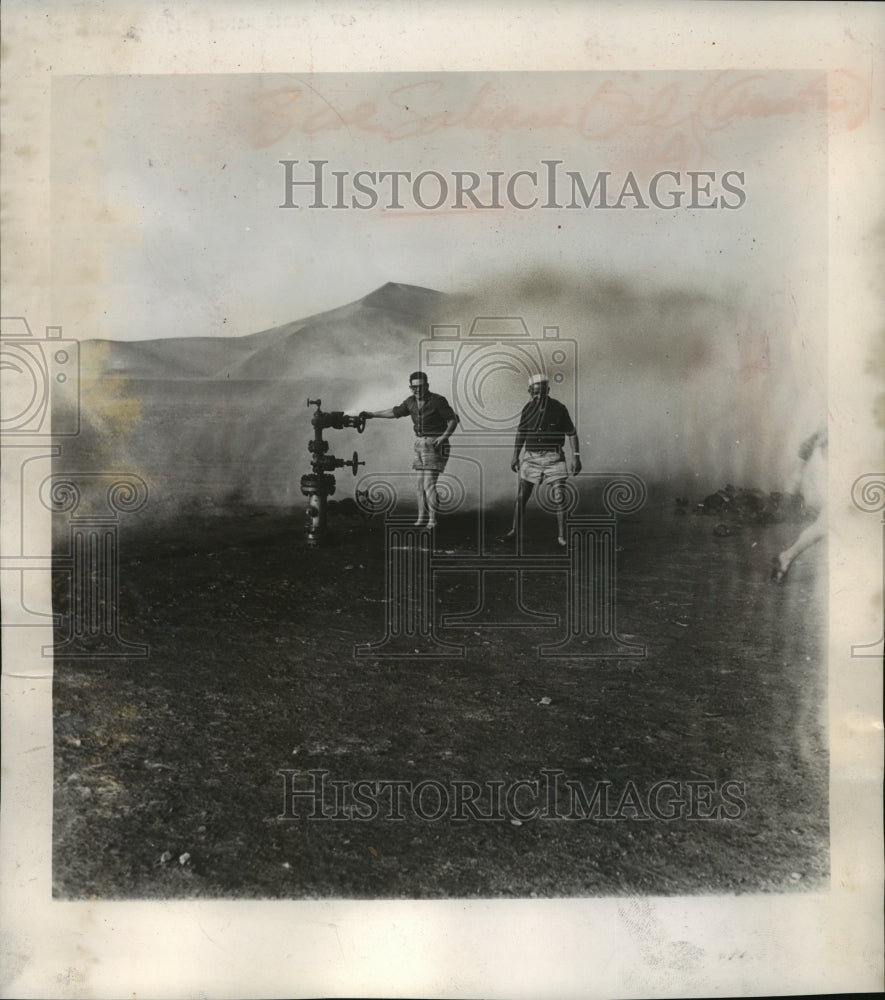 1958 Press Photo Sahara oil workers getting their baptism of oil - mja05354