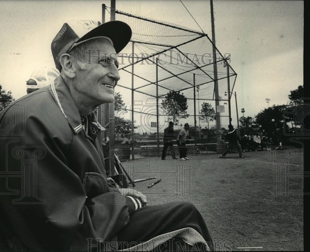 1984 Press Photo Neil Medema Watches Softball Game- Historic Images