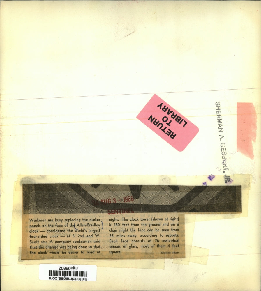 1968 Press Photo Workmen are busy replacing the darker panels on the clock