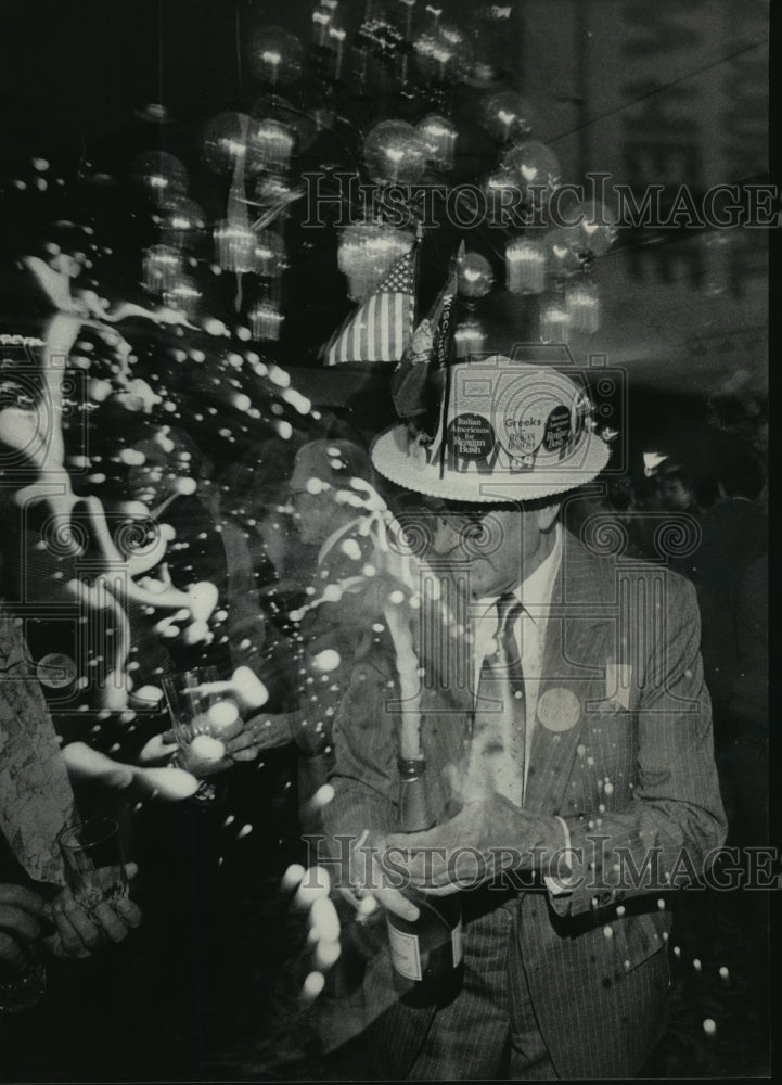 1984 Press Photo Modris Ludeks opened a bottle of champagne to celebrate - Historic Images