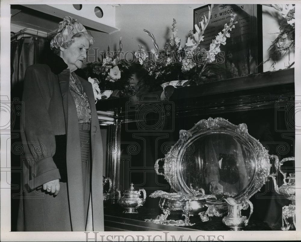 1951 Press Photo Mrs. Walter Goodland stands near silver service in wardroom- Historic Images