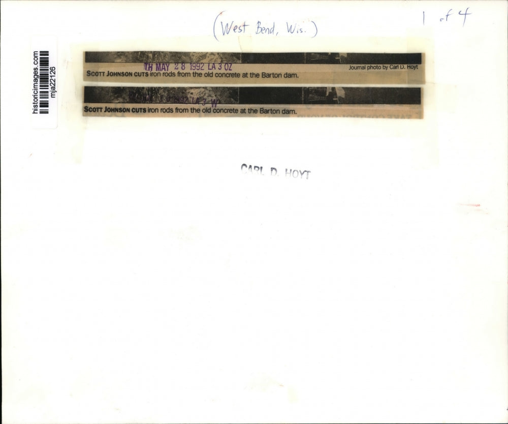 1992 Press Photo Scott Johnson cuts iron rods from the old concrete - mja22126