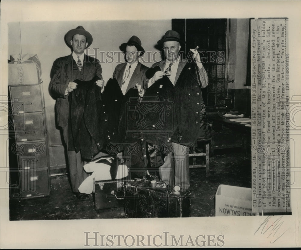 1949 Press Photo Detectives display the seven Cleveland Brink's Inc., uniforms