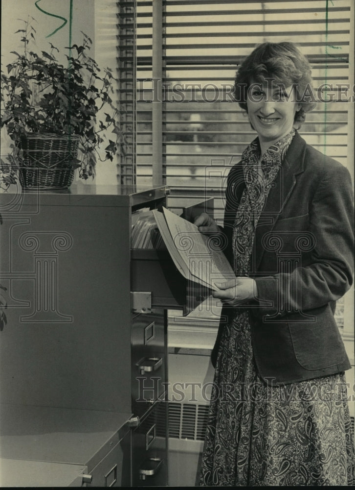 Load image into Gallery viewer, 1984 Press Photo Bonnie Laugerman in her Wauwatosa Vocational School office
